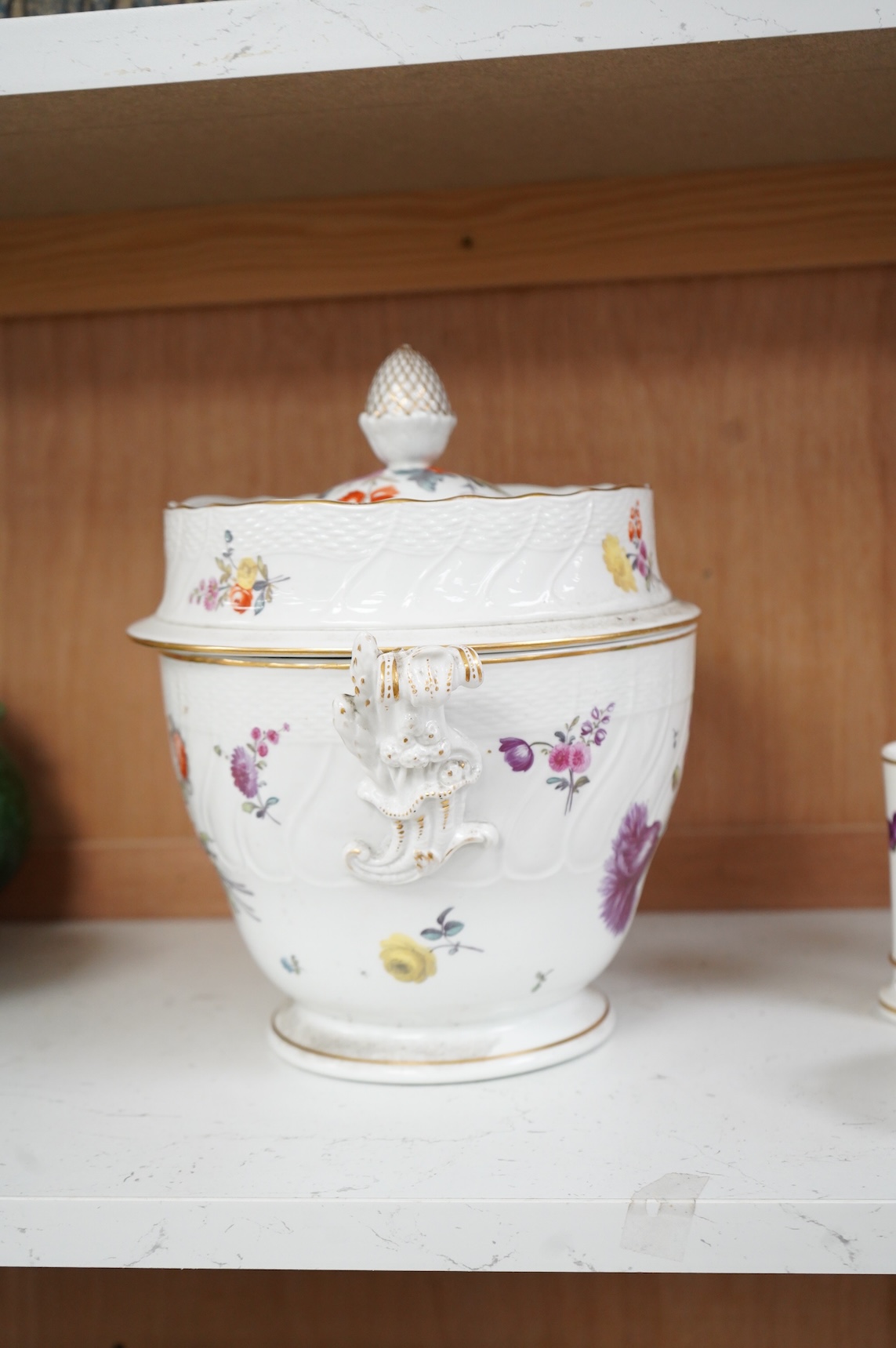 A late 18th/early 19th century English porcelain ice cream pail and cover, decorated with flowers, 27cm high